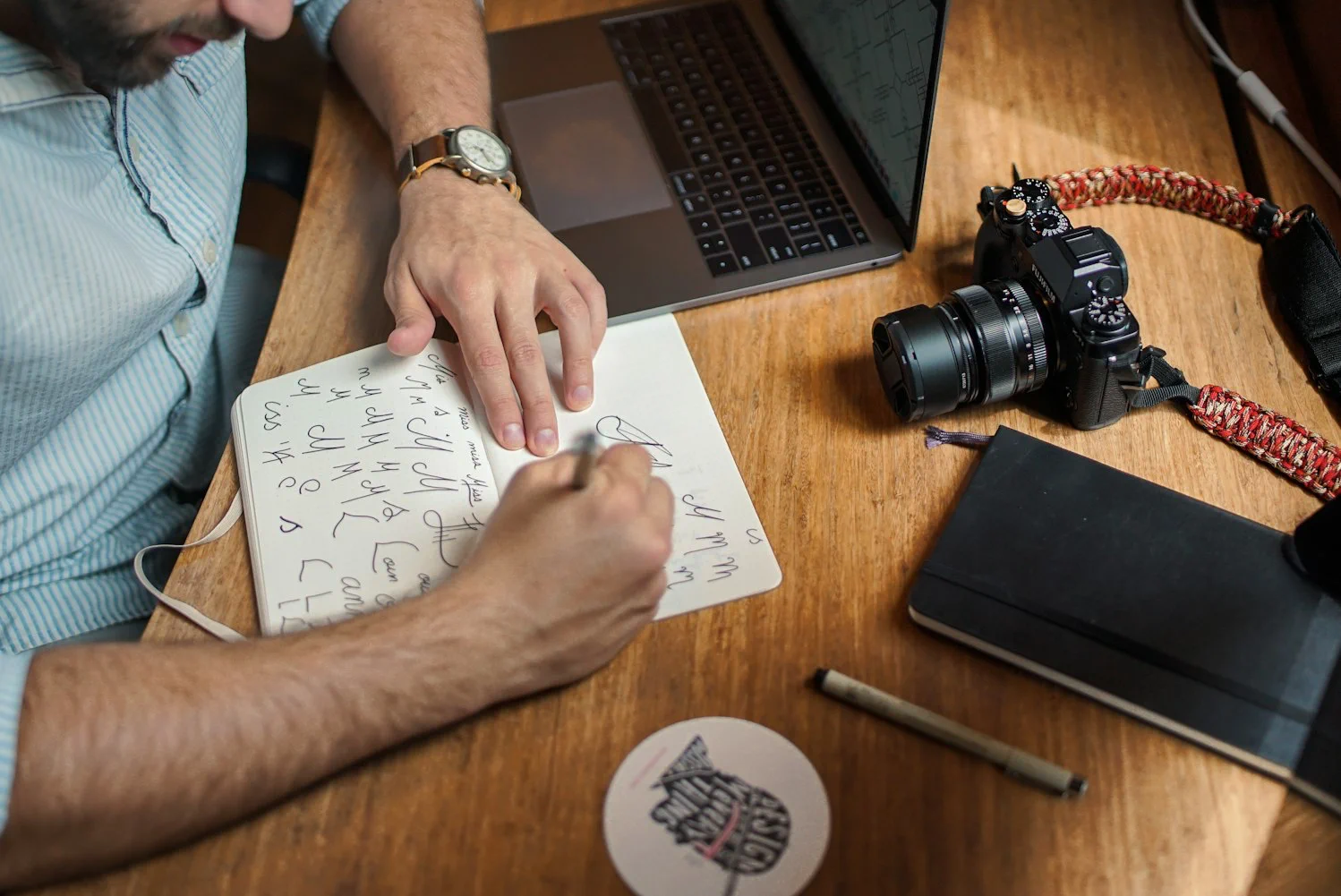 Man writing on notebook